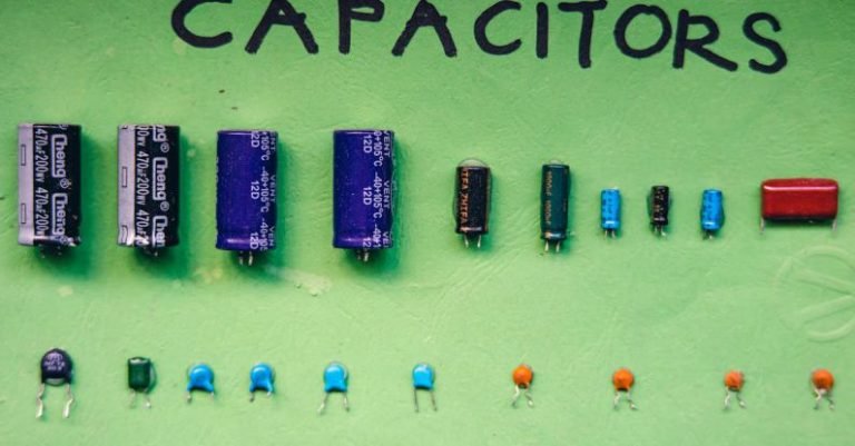 Electrolytes - Collection of capacitors on green surface